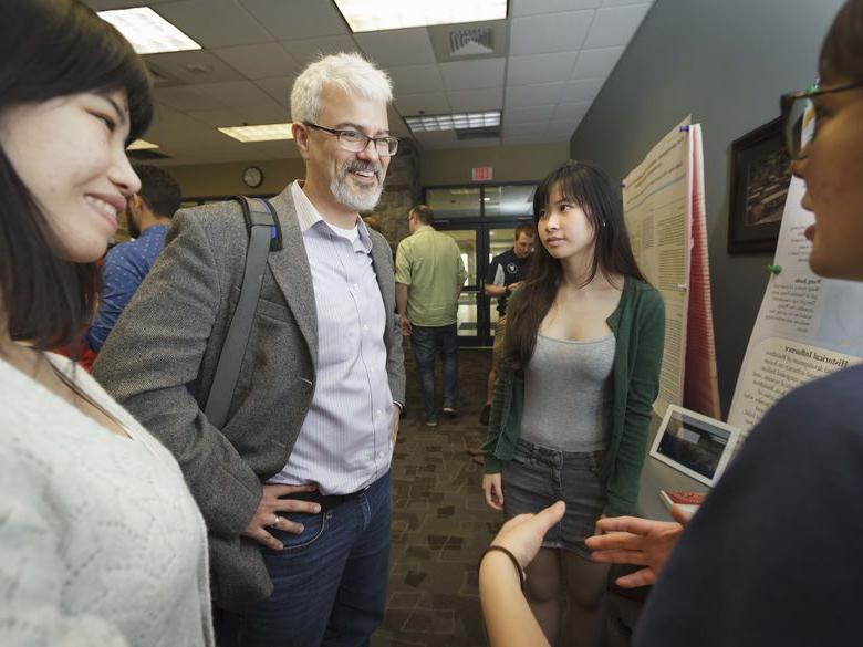 Professor talking to students